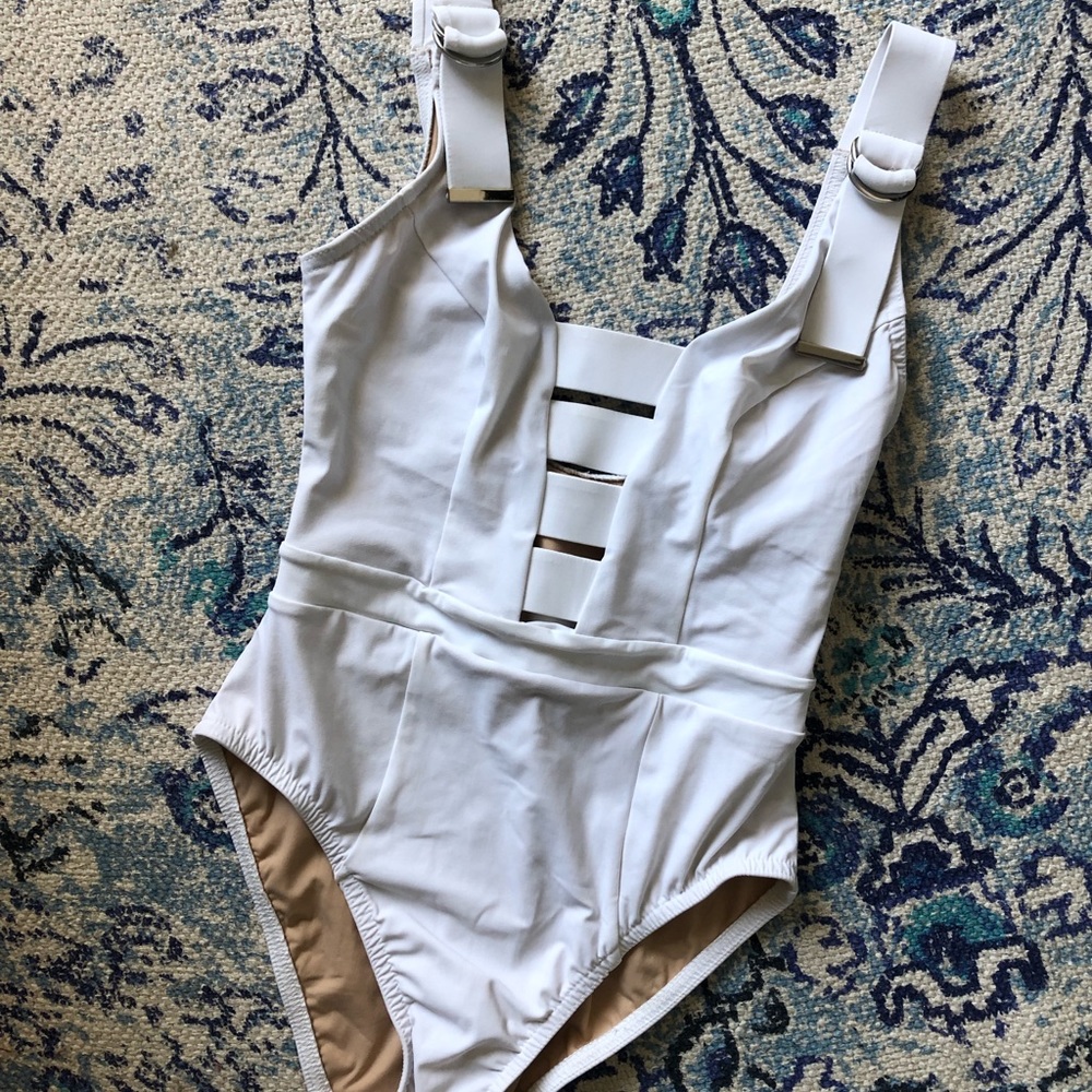 Karla Colletto one piece suit in white.
